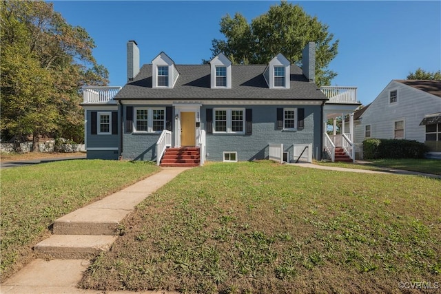 new england style home featuring a front lawn