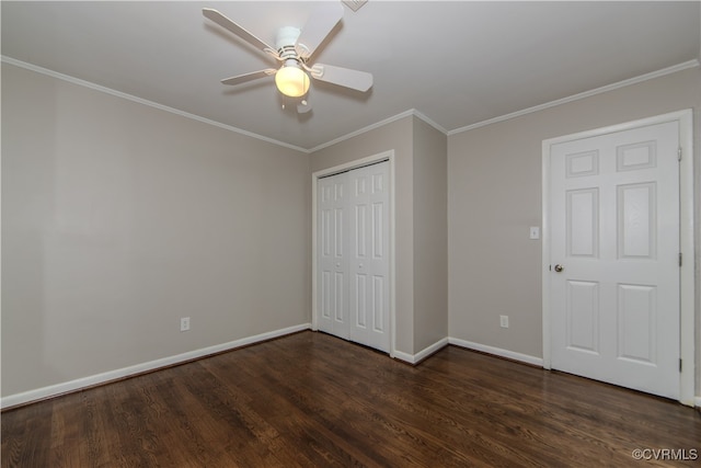 unfurnished bedroom with ceiling fan, crown molding, a closet, and dark hardwood / wood-style flooring