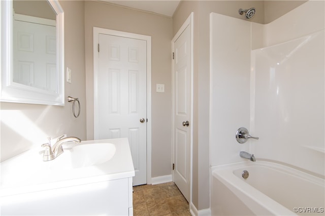 bathroom featuring bathtub / shower combination, vanity, and tile patterned floors