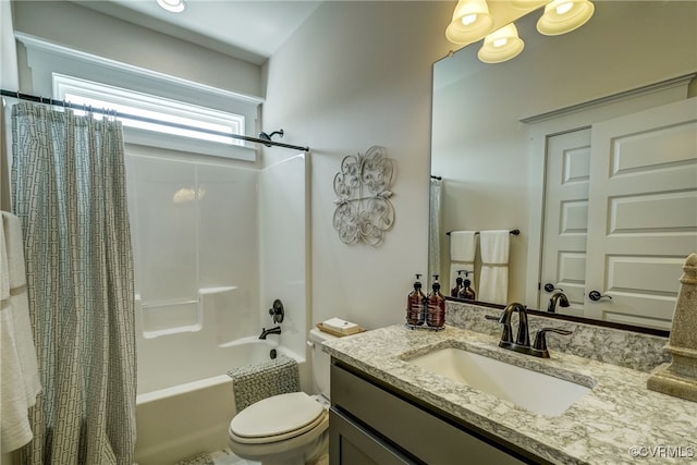 full bathroom featuring shower / bath combo, vanity, and toilet