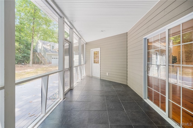 unfurnished sunroom featuring plenty of natural light