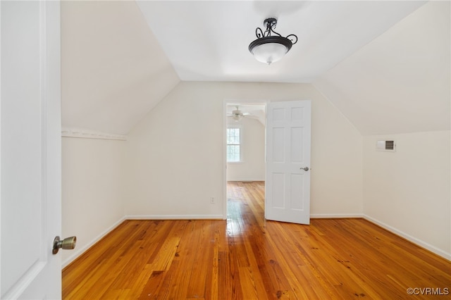 bonus room featuring hardwood / wood-style flooring, ceiling fan, and vaulted ceiling