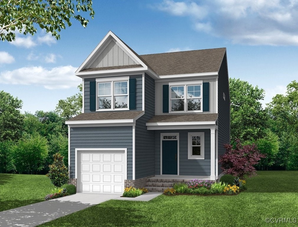 view of front of home with a garage and a front lawn