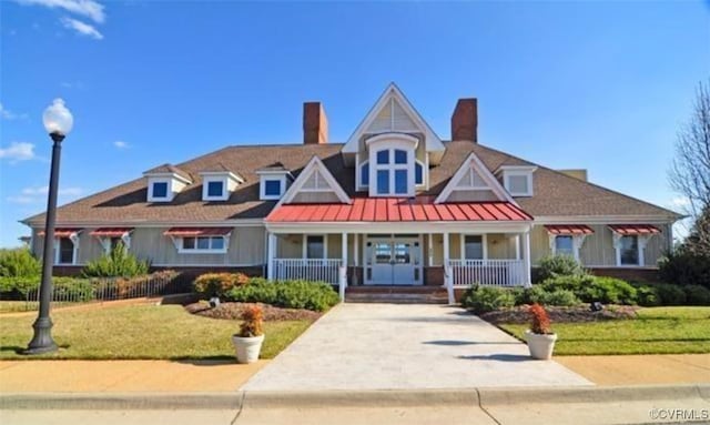 view of front facade featuring a front lawn and covered porch