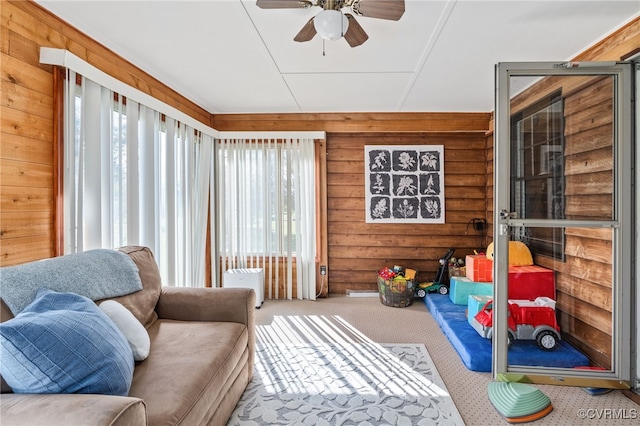 sunroom with ceiling fan and a wealth of natural light