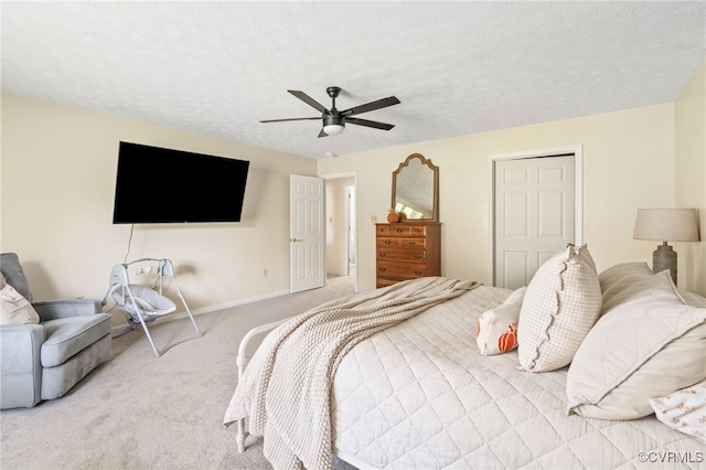 bedroom with light carpet, a textured ceiling, and ceiling fan