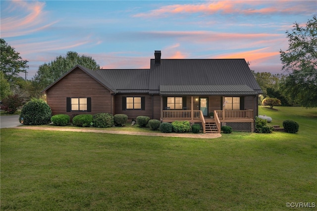 view of front of house with a yard