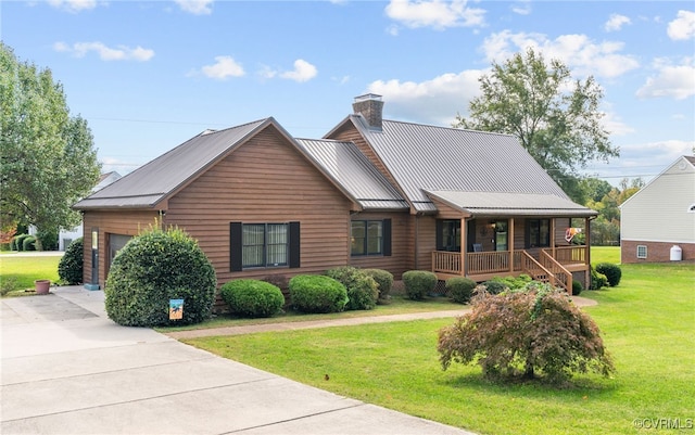 view of front facade featuring a garage, covered porch, and a front lawn