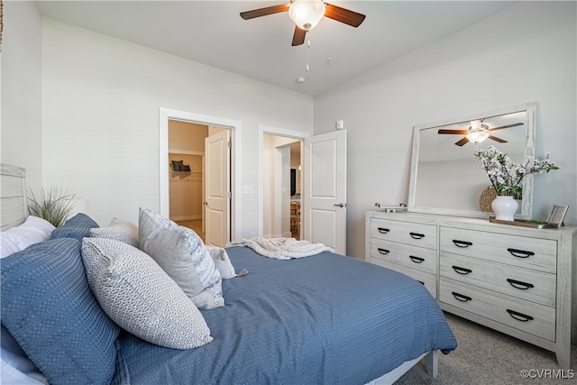 carpeted bedroom featuring ceiling fan and vaulted ceiling