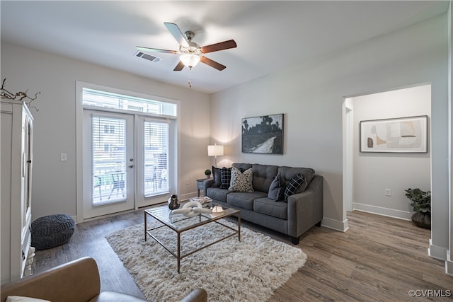 living room featuring french doors, dark hardwood / wood-style floors, and ceiling fan