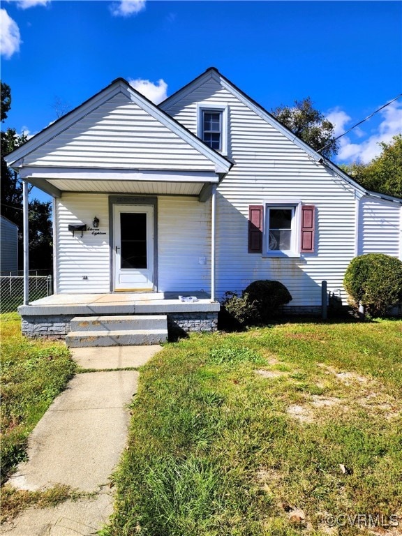 bungalow-style home with a porch and a front yard