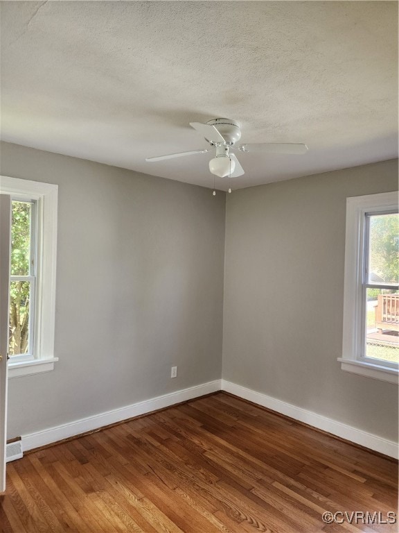 unfurnished room featuring wood-type flooring, a textured ceiling, and ceiling fan