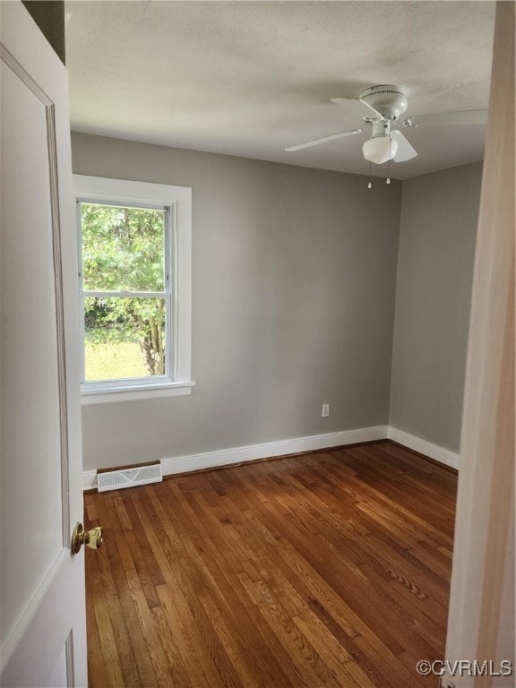 unfurnished room with wood-type flooring and ceiling fan