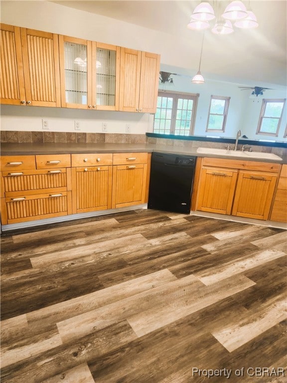 kitchen featuring ceiling fan, sink, decorative light fixtures, dishwasher, and dark hardwood / wood-style flooring