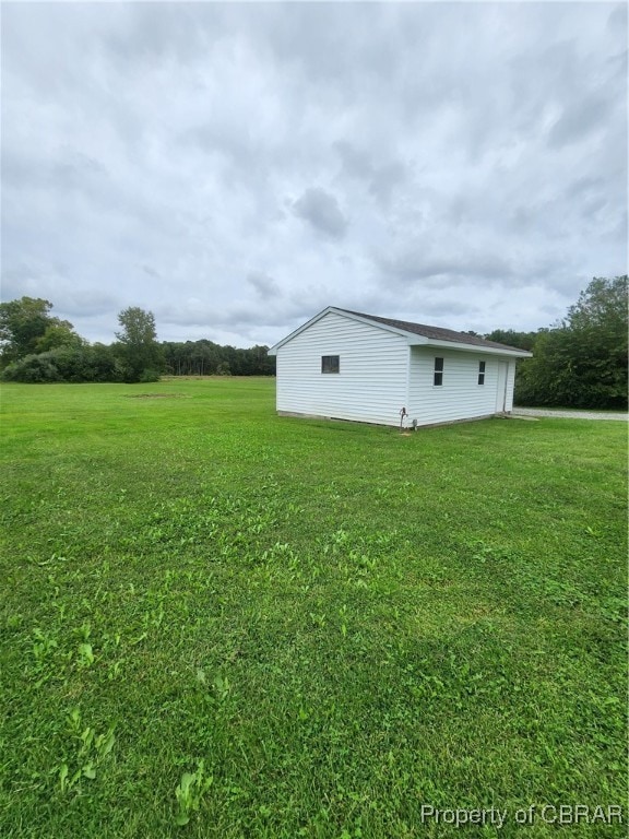 view of side of home featuring a yard