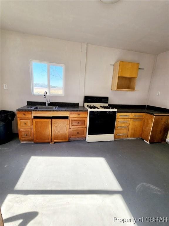 1934 Farley Park Rd, Middlesex, VA 23032 - kitchen with gas stove, a sink, concrete flooring, and dark countertops