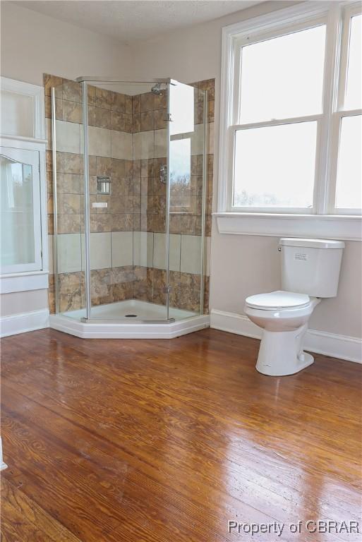 1934 Farley Park Rd, Middlesex, VA 23032 - bathroom with toilet, baseboards, and wood finished floors