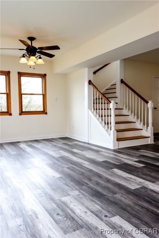 1934 Farley Park Rd, Middlesex, VA 23032 - unfurnished living room with wood finished floors, stairway, and baseboards