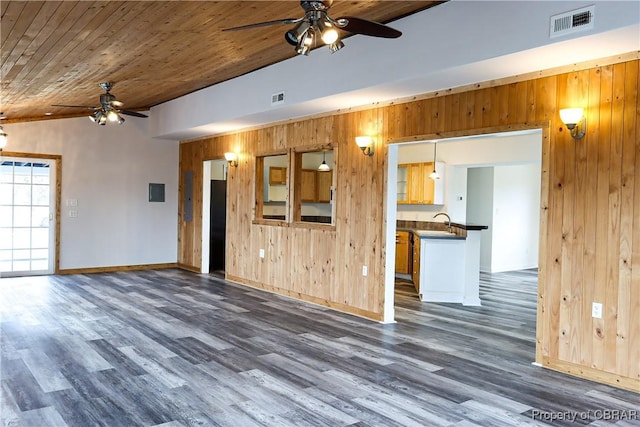 1934 Farley Park Rd, Middlesex, VA 23032 - unfurnished living room with ceiling fan, wood walls, wooden ceiling, dark wood finished floors, and baseboards