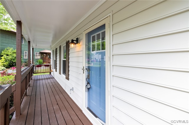 wooden terrace with a porch