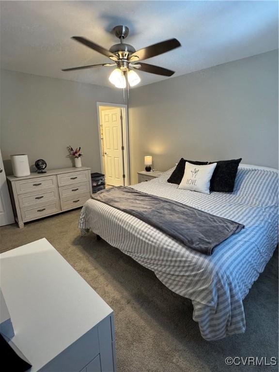 carpeted bedroom with ceiling fan