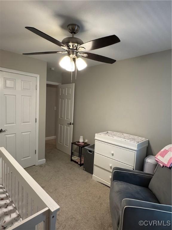 bedroom with light carpet and ceiling fan