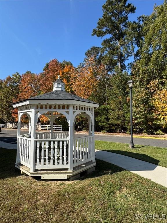 exterior space featuring a lawn and a gazebo