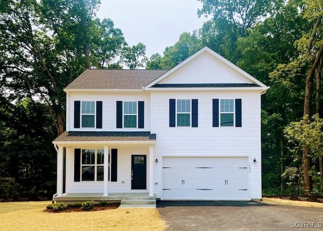 view of front facade with a front lawn and a garage