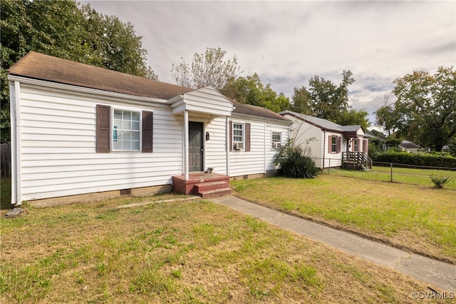 single story home featuring a front yard