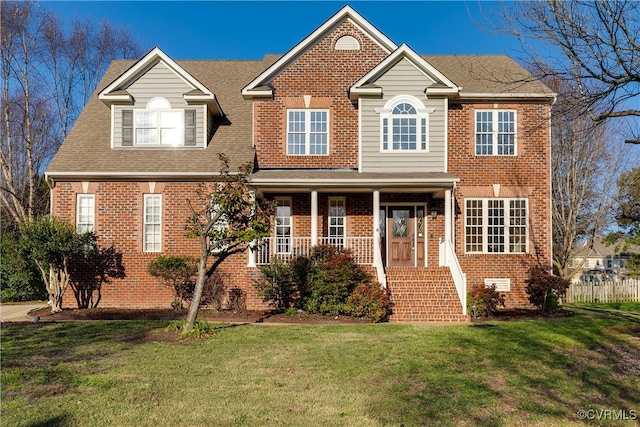 view of front of property featuring a front yard and a porch