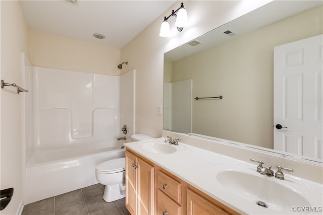 full bathroom with shower / bathing tub combination, tile patterned flooring, vanity, and toilet