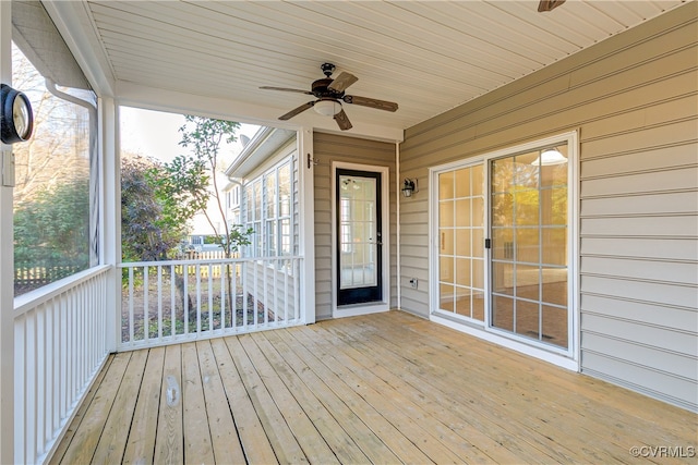 unfurnished sunroom with ceiling fan and wooden ceiling