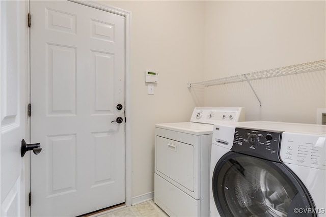 washroom with washing machine and dryer