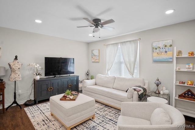 living room with light hardwood / wood-style floors and ceiling fan