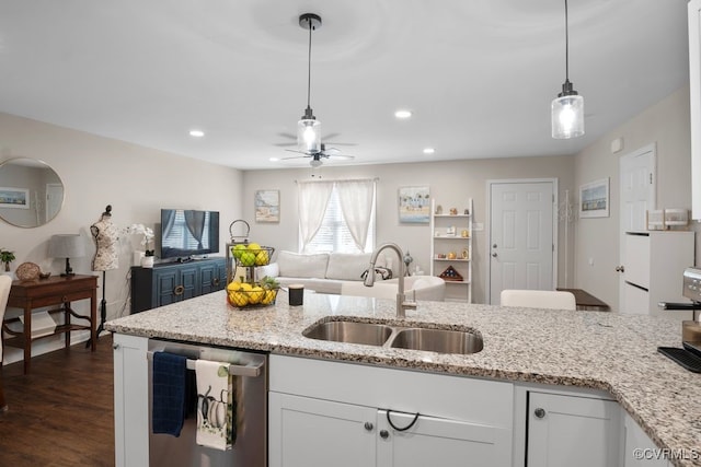 kitchen featuring sink, white cabinetry, dishwasher, and dark hardwood / wood-style floors