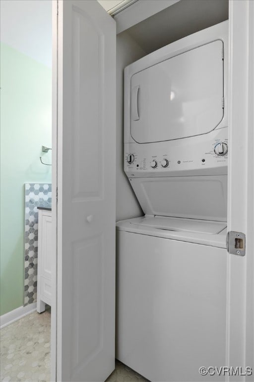 laundry area featuring stacked washing maching and dryer