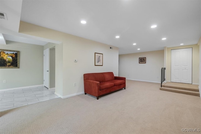 living area with light carpet