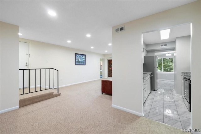 corridor with recessed lighting, baseboards, visible vents, and marble finish floor