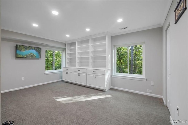 interior space with crown molding, recessed lighting, and baseboards