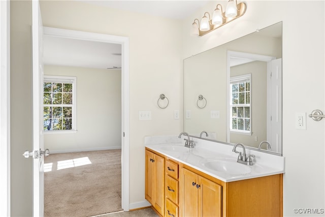 bathroom with vanity and a wealth of natural light