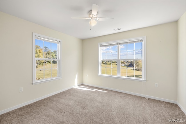 carpeted empty room with ceiling fan