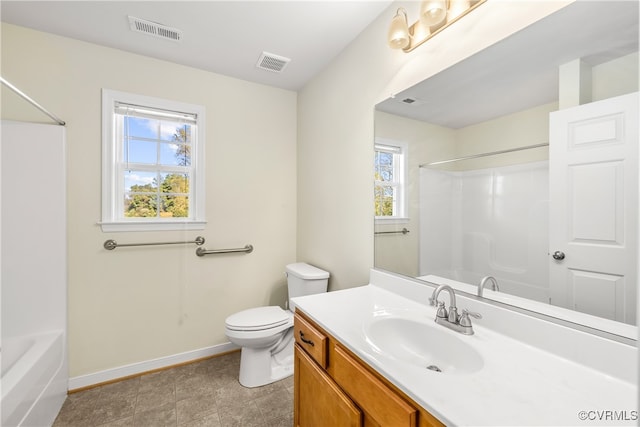 full bathroom featuring a healthy amount of sunlight, vanity, toilet, and shower / bathtub combination