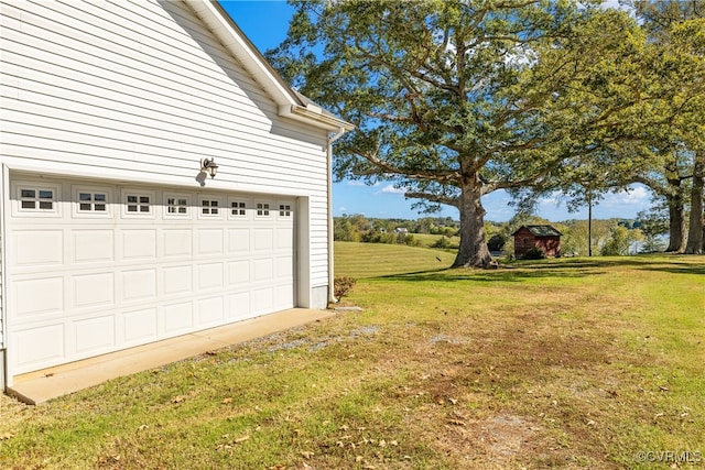 garage featuring a yard