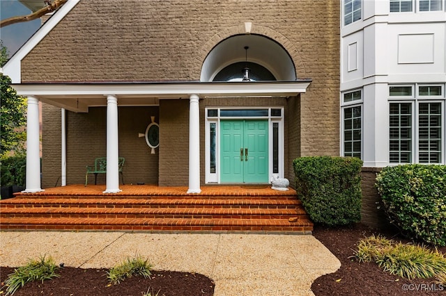 property entrance featuring covered porch