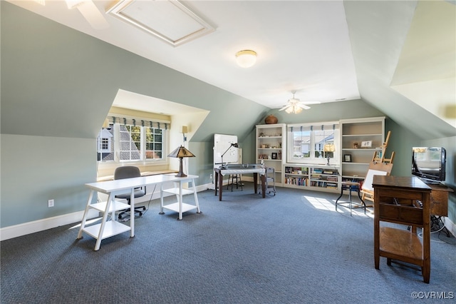 carpeted office space featuring lofted ceiling and ceiling fan