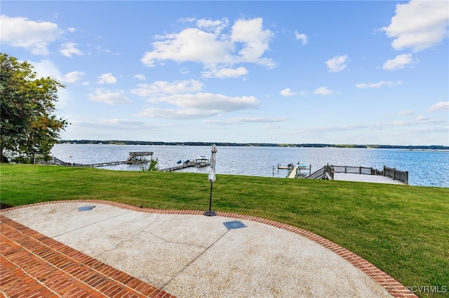 view of patio / terrace featuring a dock and a water view