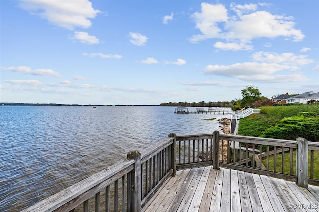 dock area with a deck with water view