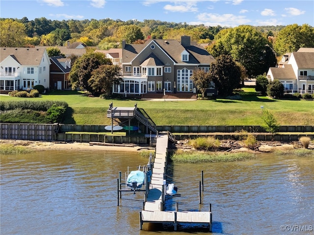 view of dock featuring a yard and a water view