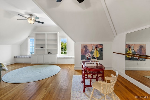 interior space featuring light hardwood / wood-style floors, ceiling fan, and vaulted ceiling