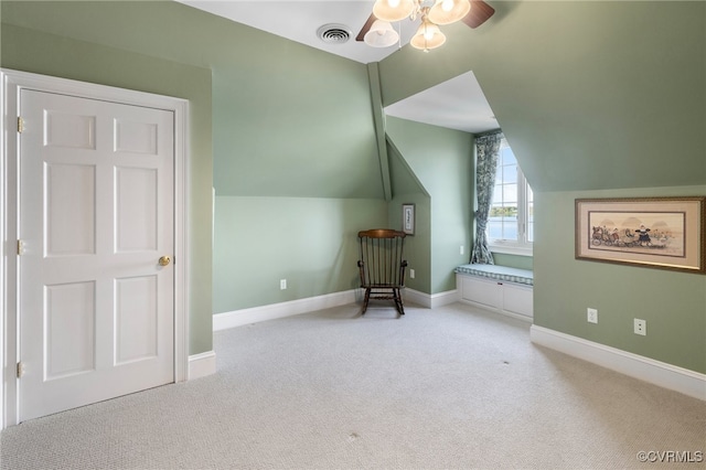 bonus room featuring ceiling fan, lofted ceiling, and light colored carpet